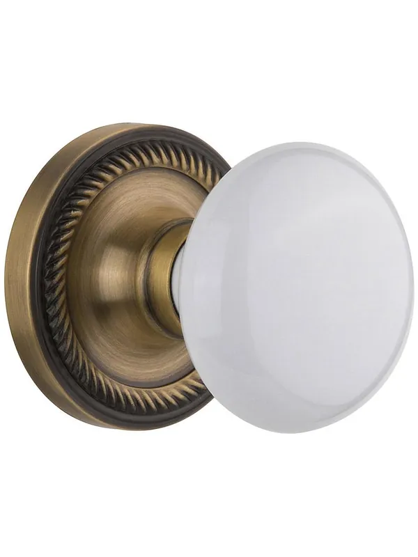 Certified Rope Rosette Door Set With White Porcelain Door Knobs - Antique Brass - Passage - 2 3/4
